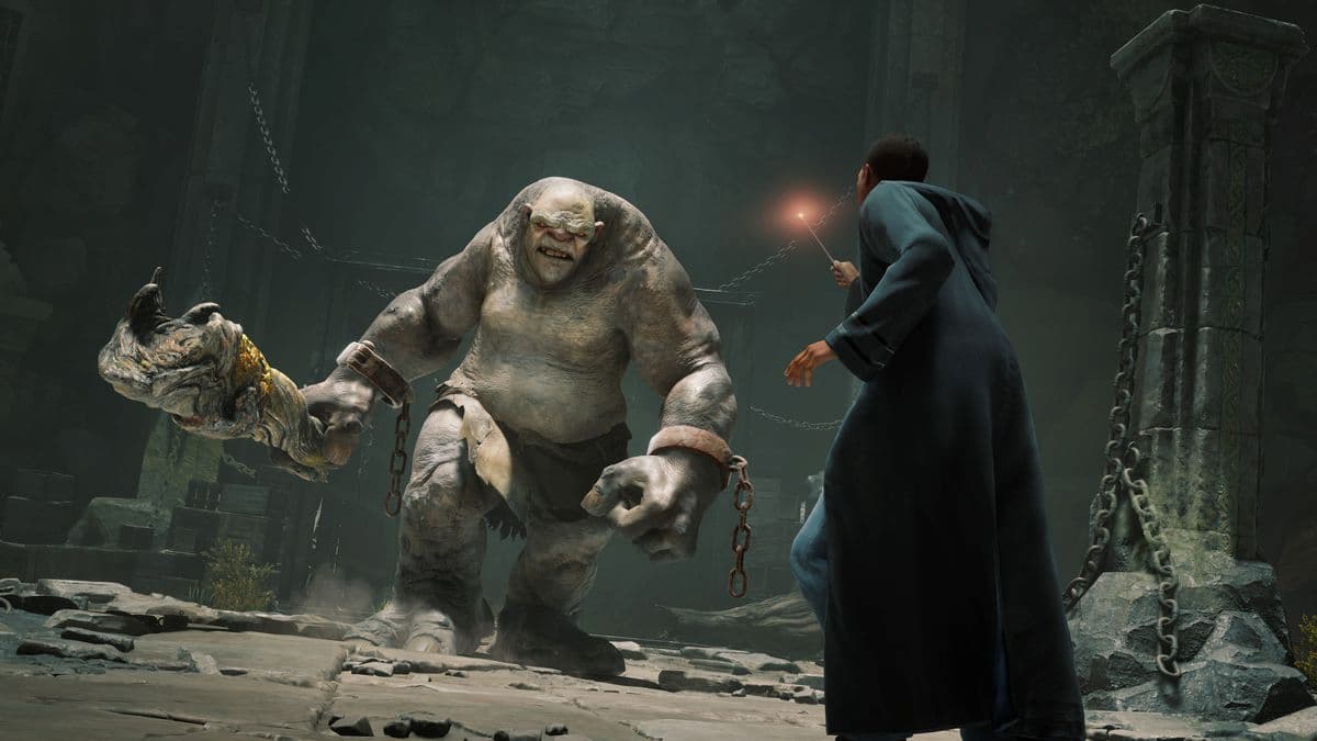 An armed troll walking up to a wizard student, who is ready to fight in Hogwarts Legacy