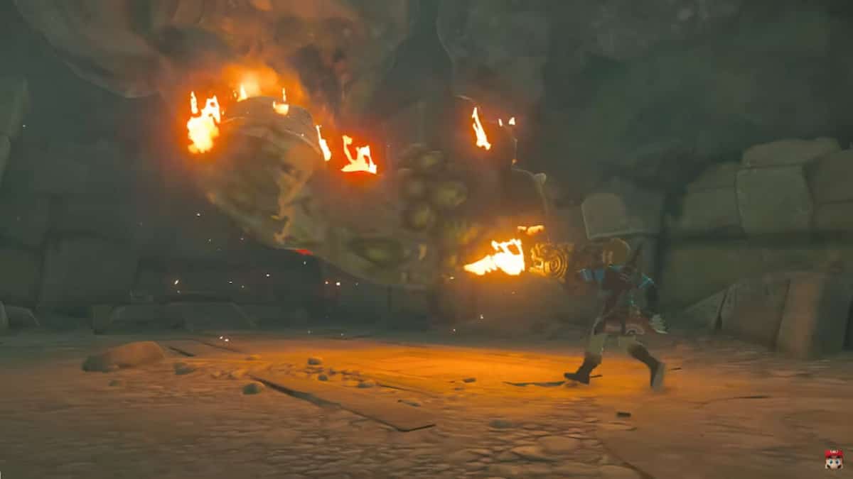 link walking in cave lit by flames in zelda tears of kingdom