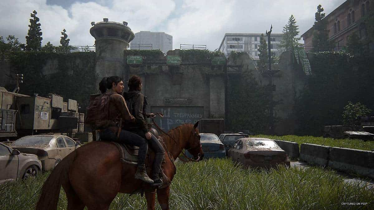 Ellie and Abby ride on the back of a horse in The Last of Us Part 2 Remastered
