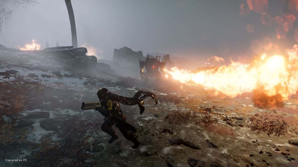 Soldier evades a fire blast in Helldivers 2