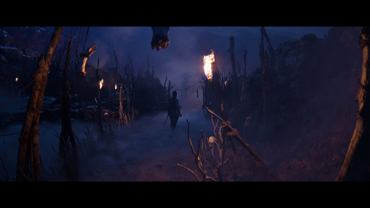Senua's Saga: Hellblade 2 Senua walking through a dark forest