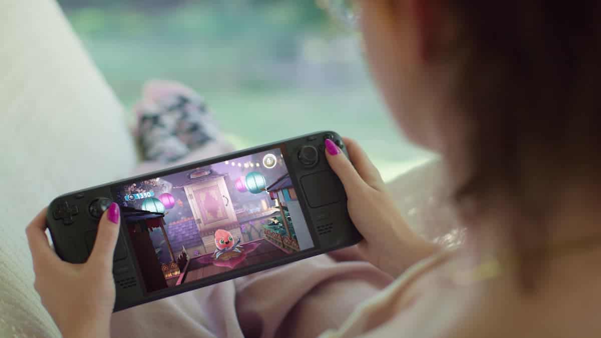A woman playing games on her Steam Deck.
