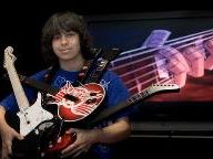 16-Year Old Drops Out of School to Play Guitar Hero
