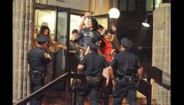 Russell Brand dressed as Batman on set with his Robin, Luis Guzman for Arthur