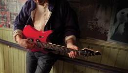 Power Gig literally burns Guitar Hero. In a volcano.