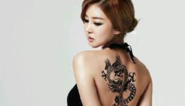 Korean singer NS Yoon-G reveals sexy dragon tattoo for online game “Dragon”