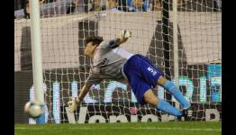 Midfielder Agustin Pelletieri saves a penalty for Racing Club v San Martin San Juan