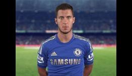 Hazard kicks ball boy