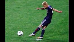 Japan become first team to qualify for 2014 World Cup finals in Brazil after 1-1 draw with Australia