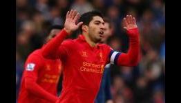 Suarez signing would make Arsenal title contenders again, says Forlan