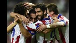 Real Madrid 1-2 Atletico Madrid: Turan strikes early title blow