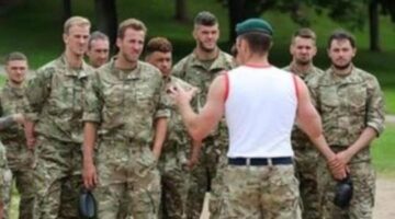 Tactical manoeuvre: the England squad train with the Royal Marines