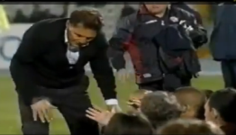 Linesman runs through Livorno manager Walter Novellino