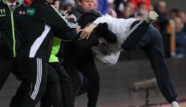 Pitch invader attacks Neil Lennon during match