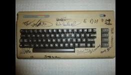 A Commodore 64 covered in Retro Celebrity Signatures