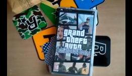 A guy unboxes San Andreas Stories for the PSP.