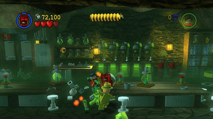 Screenshot of gameplay from Lego Batman the Videogame. Shows Batman fighting criminals.