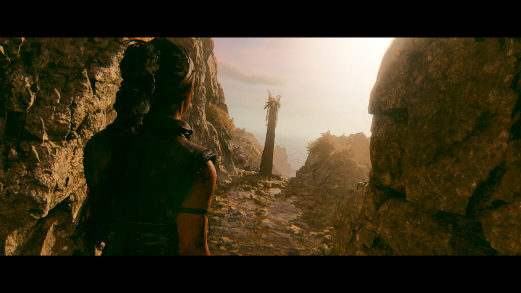 Senua's Saga: Hellblade 2 protagnost looking at a totem